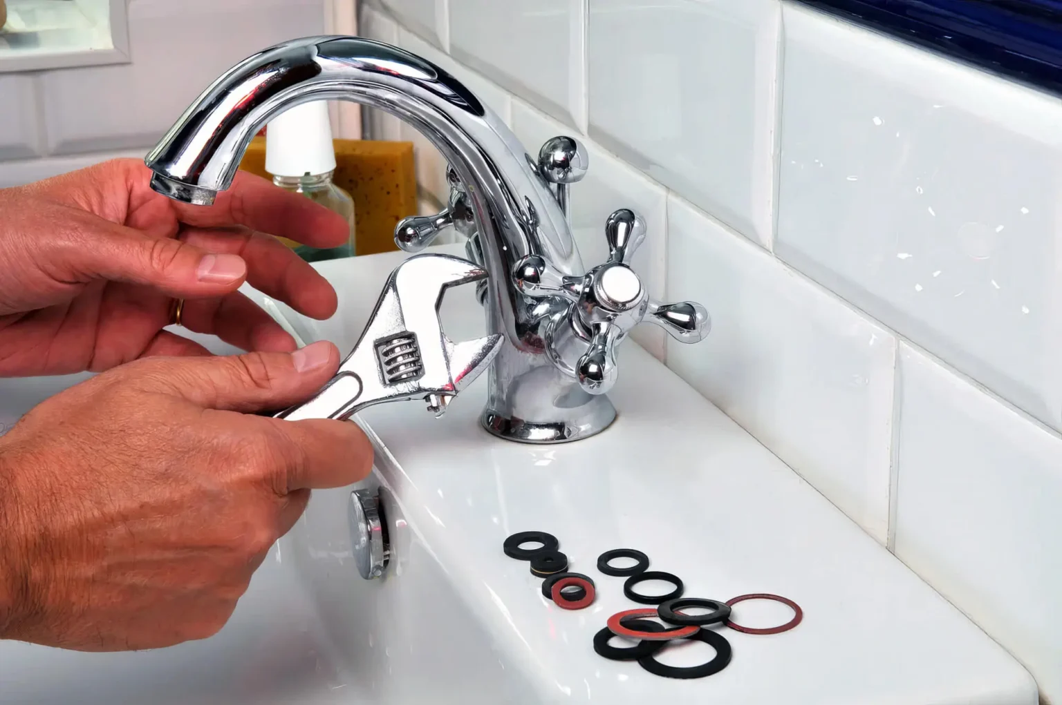 Plumber maintaining a bathroom faucet in Moreno Valley