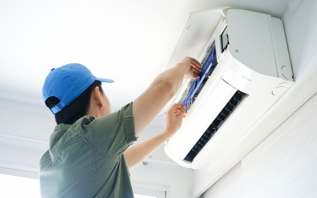 HVAC technician servicing a ductless mini split in Moreno Valley