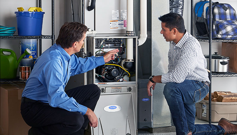 Technician evaluating a furnace for repair or replacement in Moreno Valley