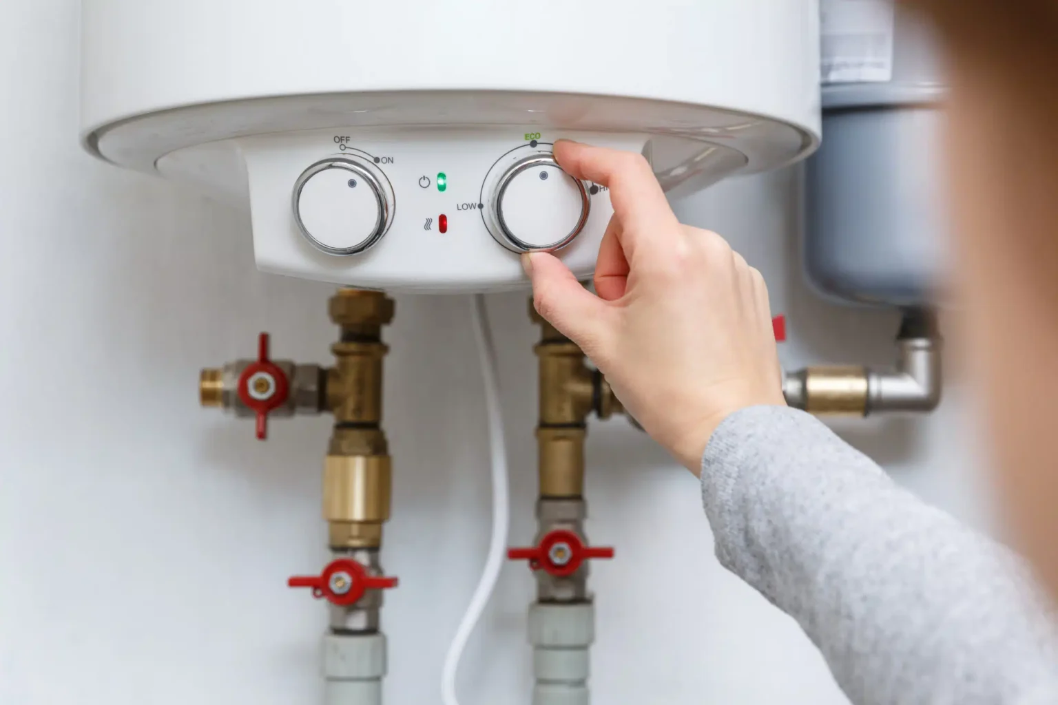 Technician adjusting a water heater in Moreno Valley